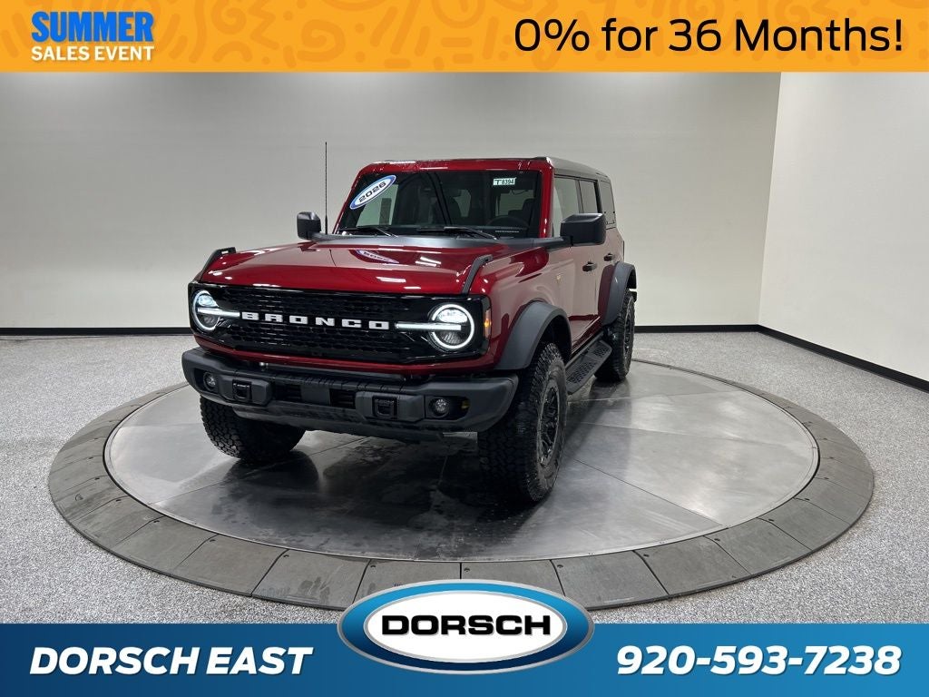 2026 Ford Bronco Badlands in Ruby Red Metallic Tinted Clearcoat — front three-quarter view
