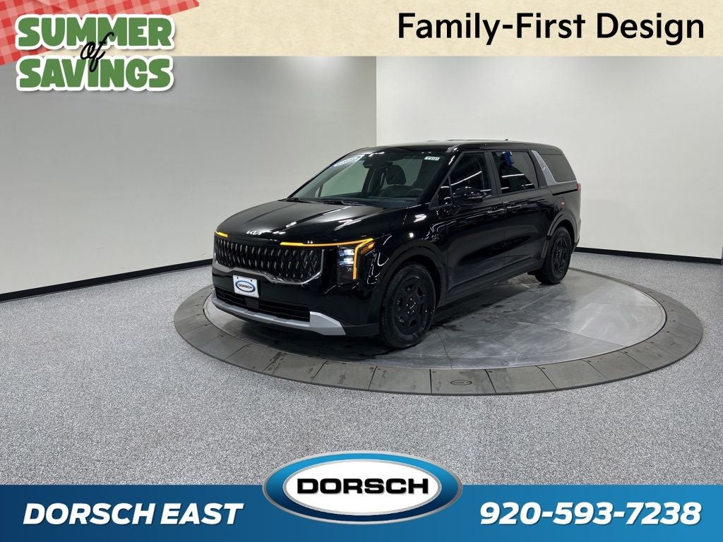 2026 Kia Carnival LXS in Aurora Black Pearl — front three-quarter view